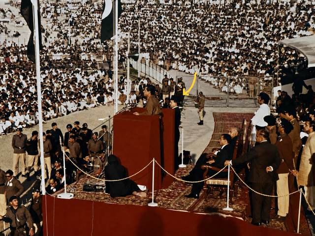 Colonel Gaddafi addressing the crowd at Lahore Stadium during the Second Islamic Summit Conference, February 1974, where Dr. Azhar delivered his impromptu translation
