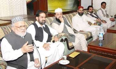 Dr. Zahoor Ahmad Azhar in a meeting with colleagues